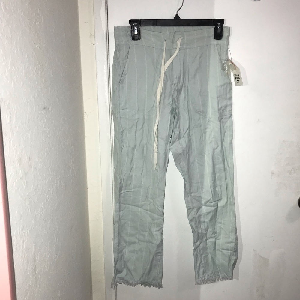 Mint Billabong Pants with white stripes.